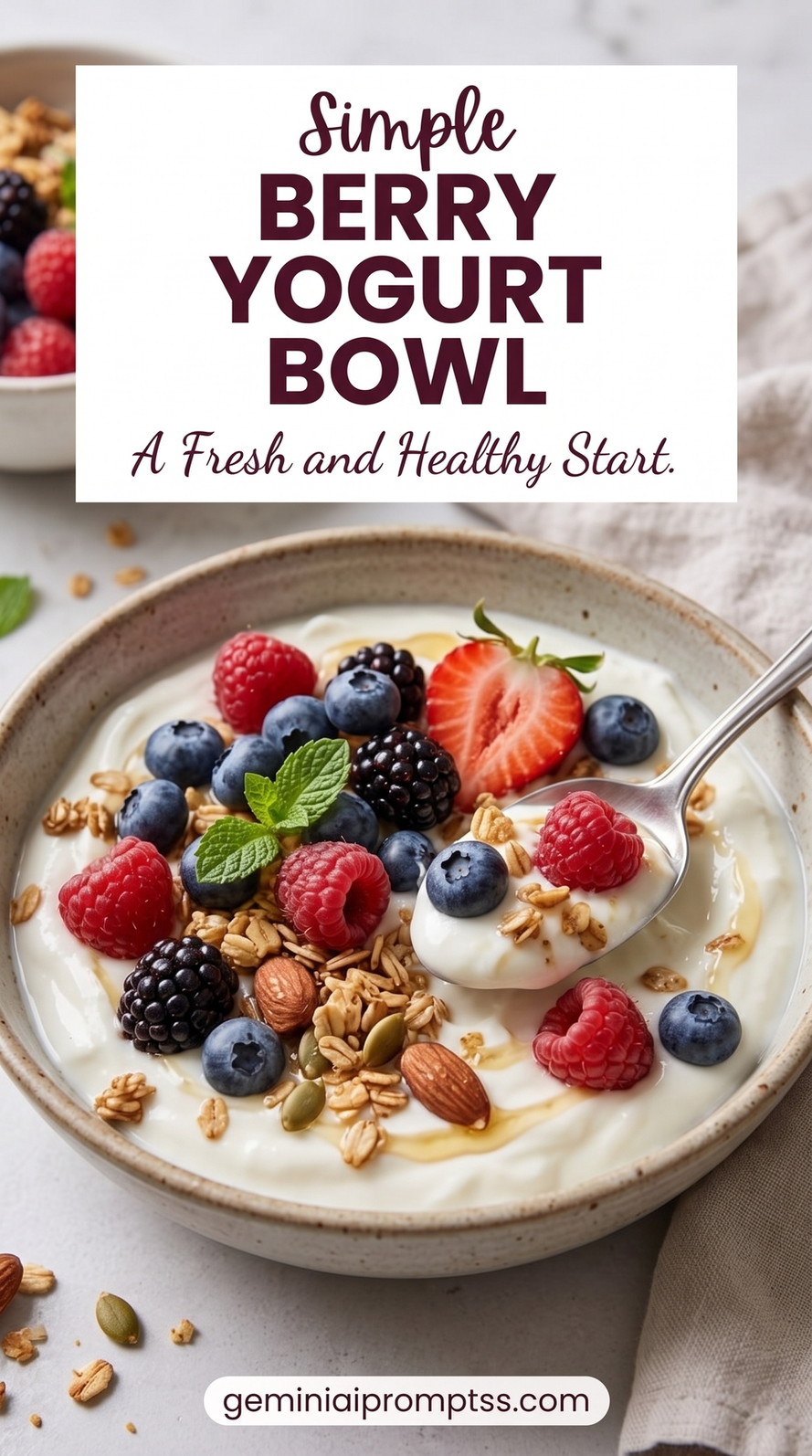 Berry Yogurt Bowl showing Greek yogurt with strawberries, blueberries, raspberries, granola, almonds, seeds, and mint